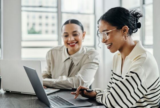 Two women looking at a computer